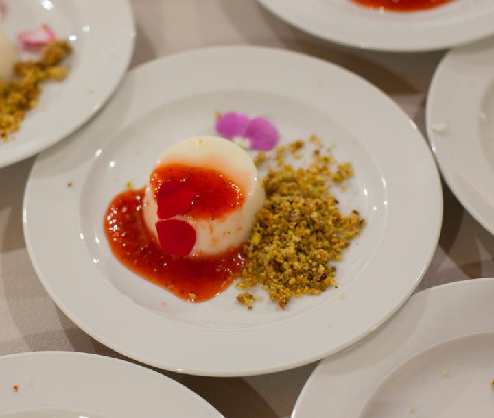 Bianco mangiare with a wild strawberry sauce from Ribera, almond and sage crumble